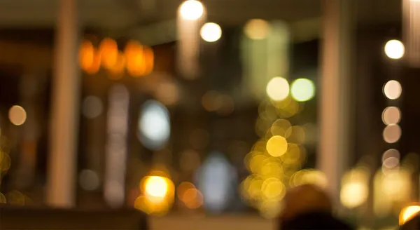 The warmly lit dining room at Spice Room set for an evening service.