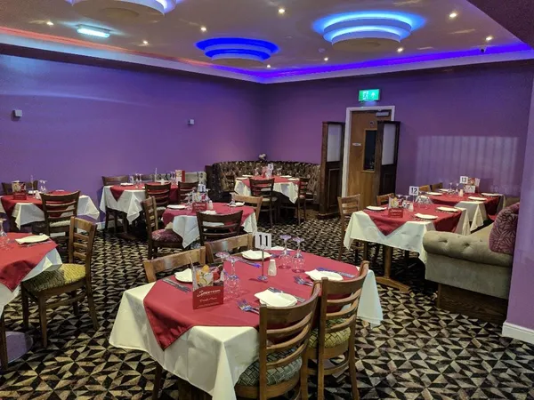 A view across the Spice Room restaurant showing neatly laid tables.